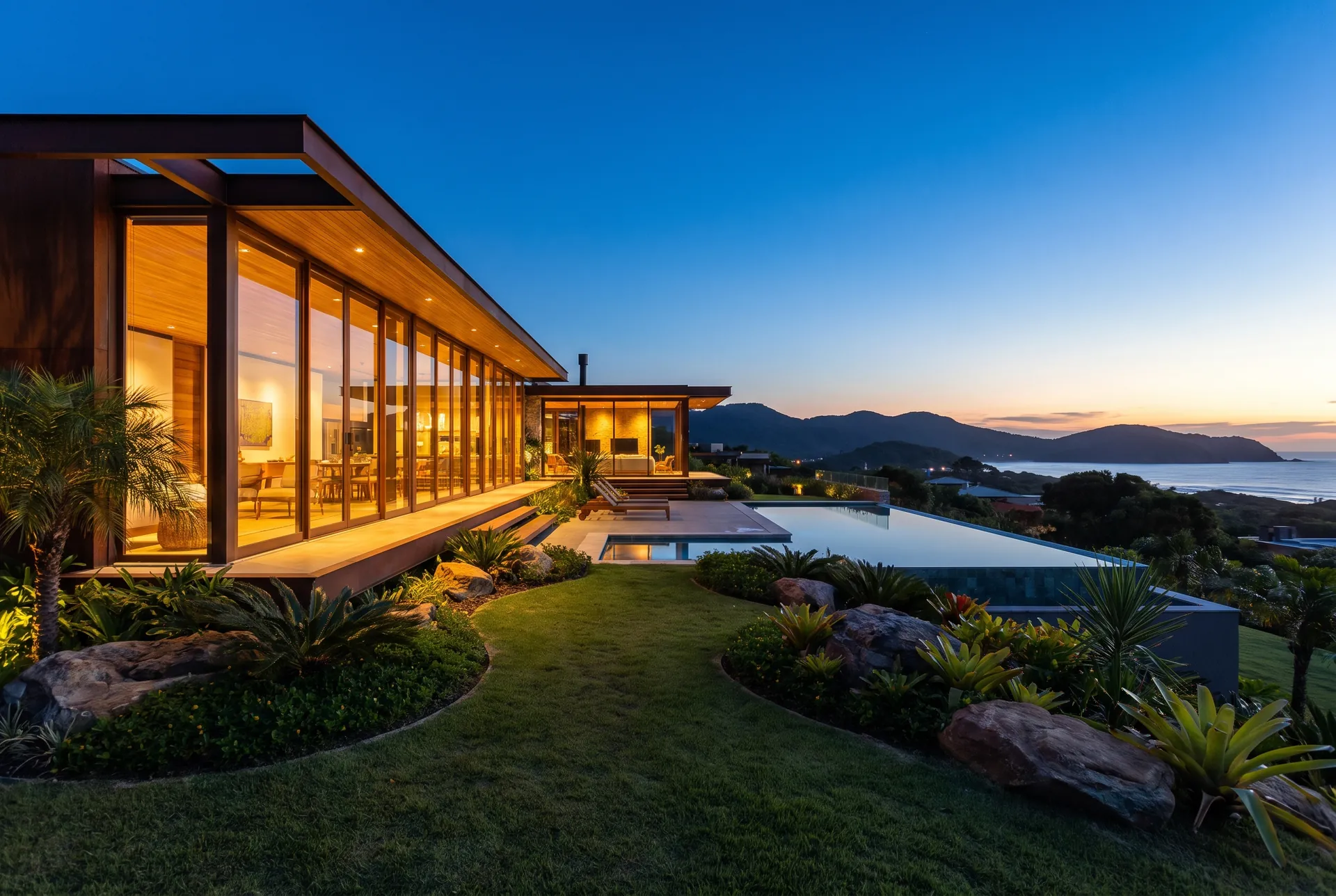 Fachada noturna de casa contemporânea com iluminação interna acesa